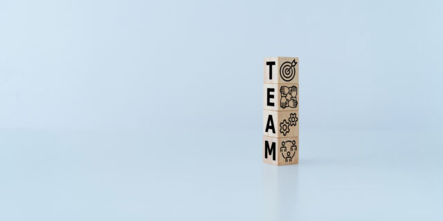 Blocks spelling out the word team.